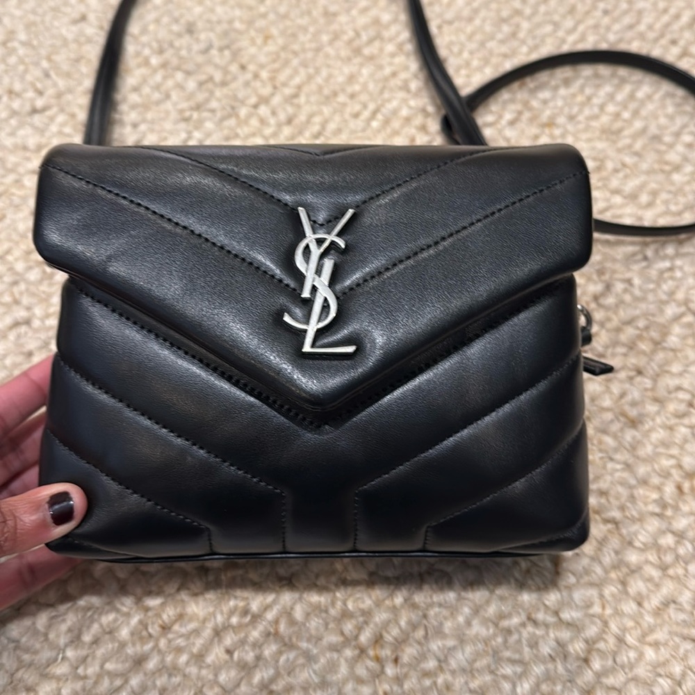 Saint Laurent Toy Loulou black bag with silver hardware.